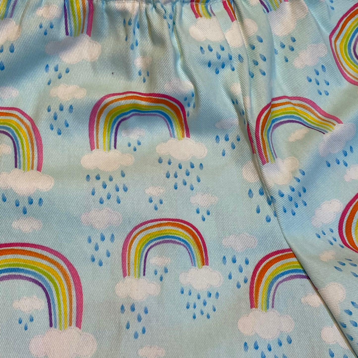 Shorts - Rainbows on Light Blue with White Anglaise Hemline and Elastic Waist